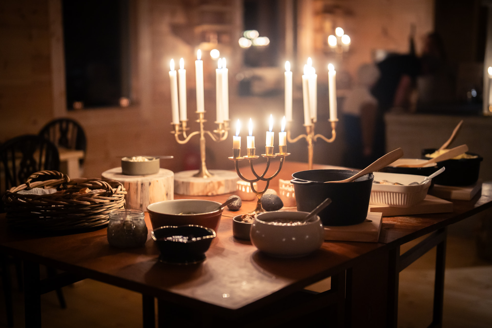 Candlelit dinner table laid for an evening meal in the Main Cabin
